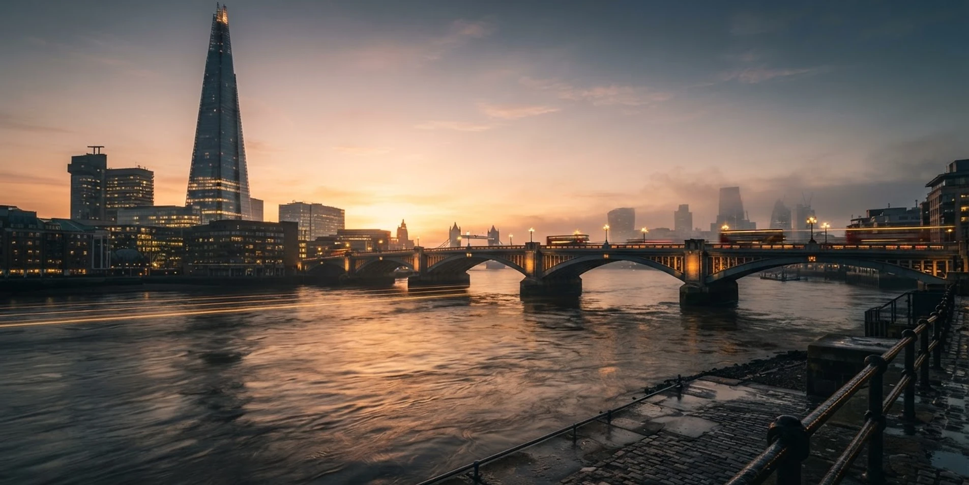 The Shard and London Bridge at sunrise over the Thames
