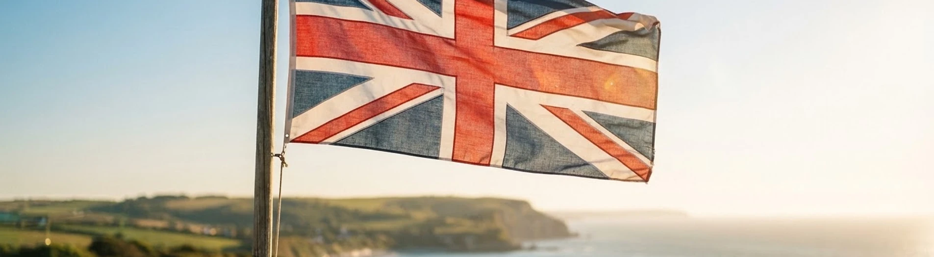 The Union Jack flag waving against a clear sky